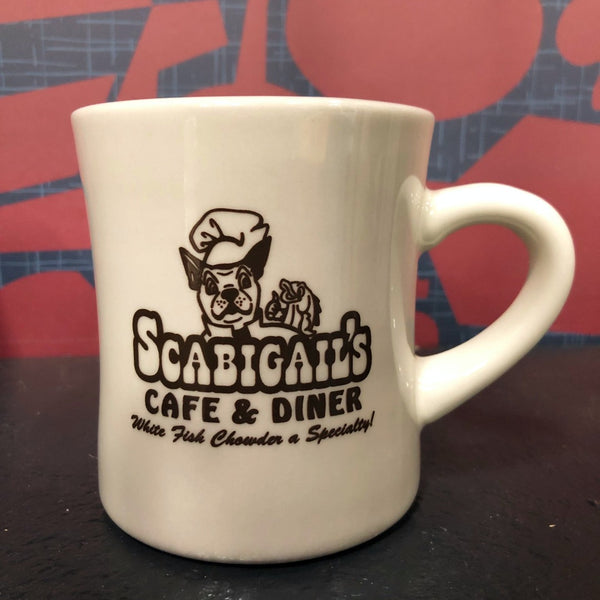 A retro Scabigail's Cafe & Diner mug on the set of Good Eats.